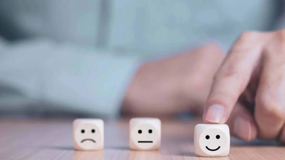 Businessman chooses a smile emoticon icons face happy symbol on