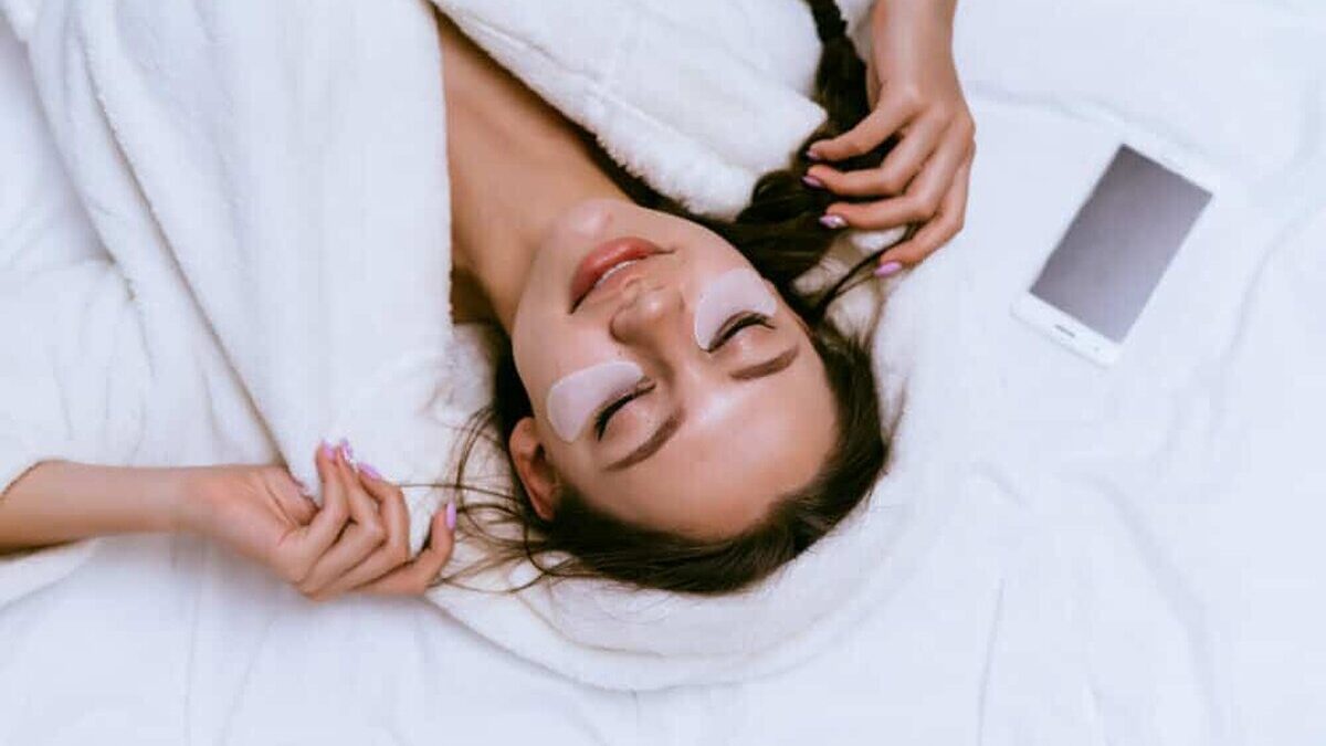 A,Woman,In,A,Robe,Is,Lying,In,Bed,And