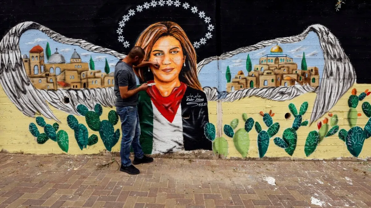 1683787103_2022-05-16T162509Z_1786131130_RC2G8U9S57I7_RTRMADP_3_ISRAEL-PALESTINIANS-JOURNALIST-MURAL.jpg