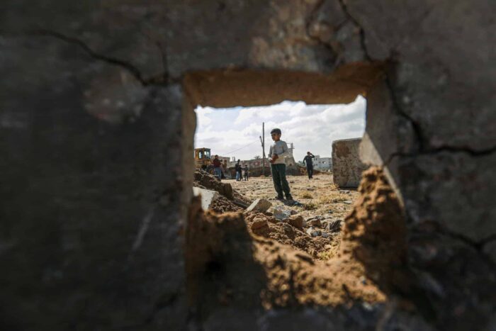 A child inspects the site of the bombing in Deir al Balah central Gaza Strip 1683179216