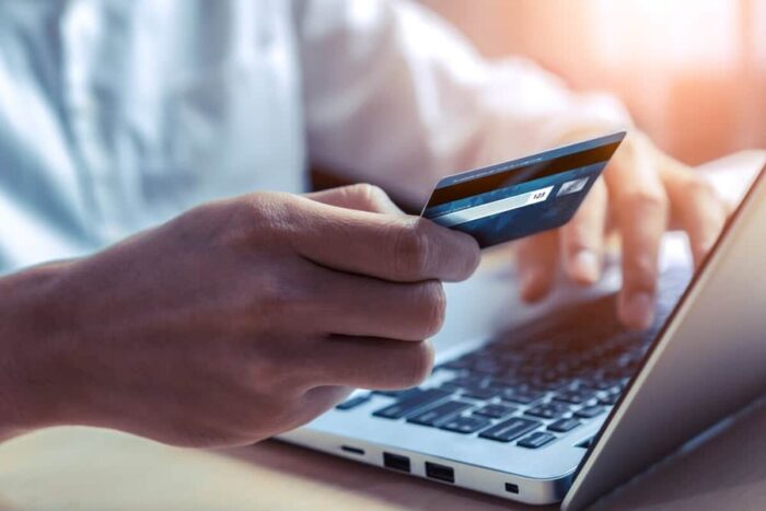 Young,Man,Use,Credit,Card,For,Shopping,Payment,Online,On