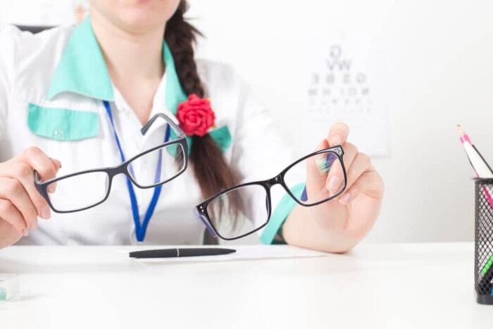 Doctor,Ophthalmologist,Holds,In,His,Hands,Two,Glasses,For,The