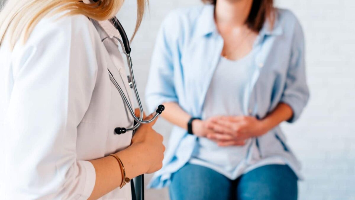 female-patient-with-abdominal-pain-caused-by-stomach-cancer-examined-by-female-specialist