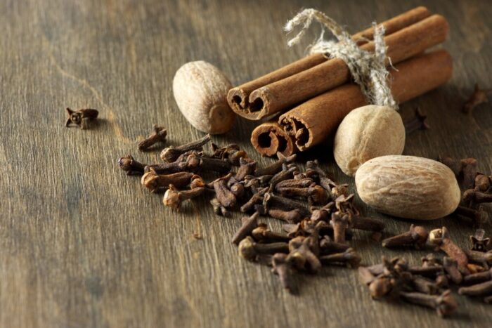 Cinnamon,,Nutmeg,And,Cloves,On,Wooden,Background.