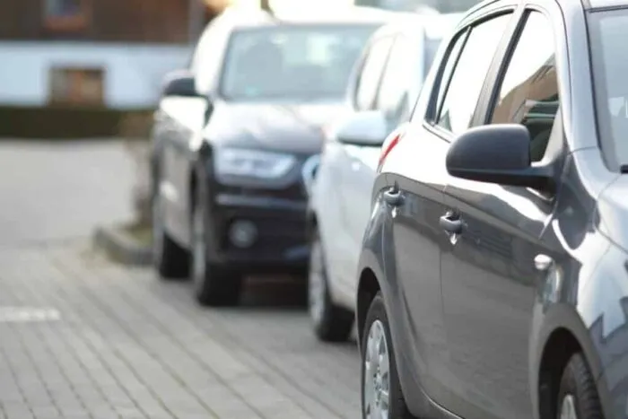 closeup-shot-black-car-parking-lot-with-blurred-background-1024x683.jpg