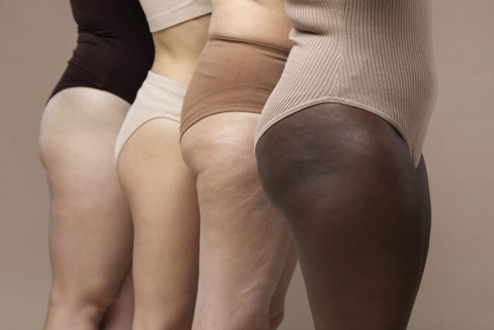 different women standing together scaled