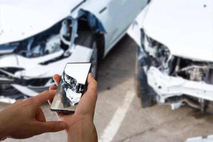 man-photographing-his-vehicle-with-damages-accident-insurance-with-smart-phone-1024x683.jpg
