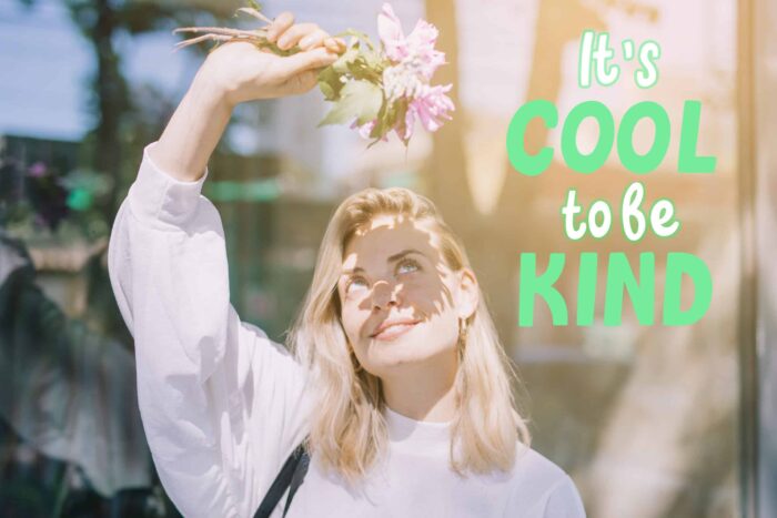 world kindness day with woman holding flowers scaled