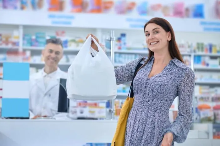 contented-long-haired-woman-looking-contented-after-buying-goods-drugstore-1024x681.jpg