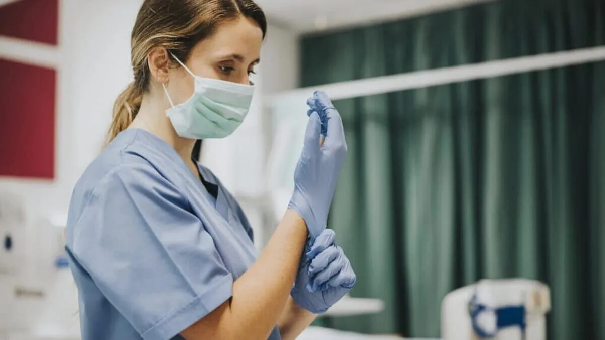 female-nurse-with-mask-putting-gloves-1024x683.jpg