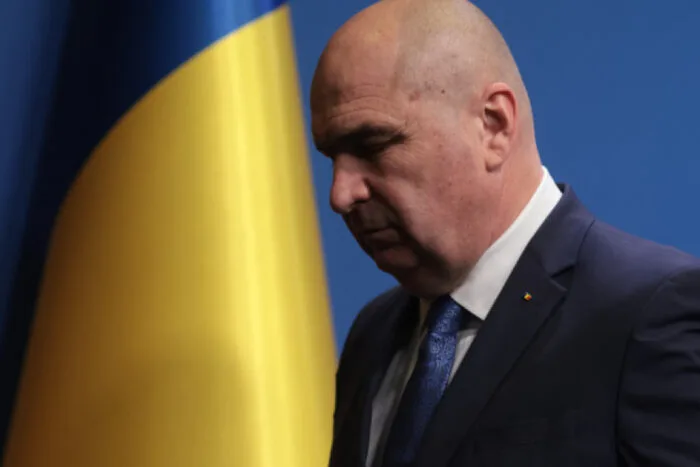 Ilie Bolojan, lângă drapelul României